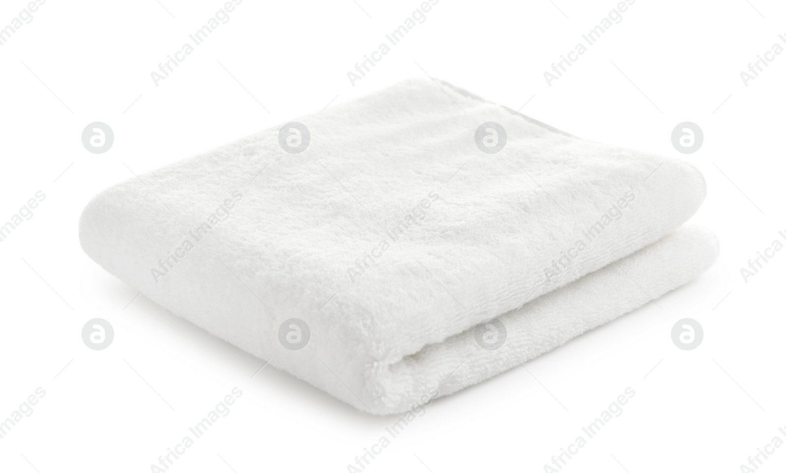 Photo of Folded clean soft towel on white background