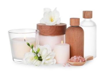 Beautiful spa composition with different care products and flowers on white background