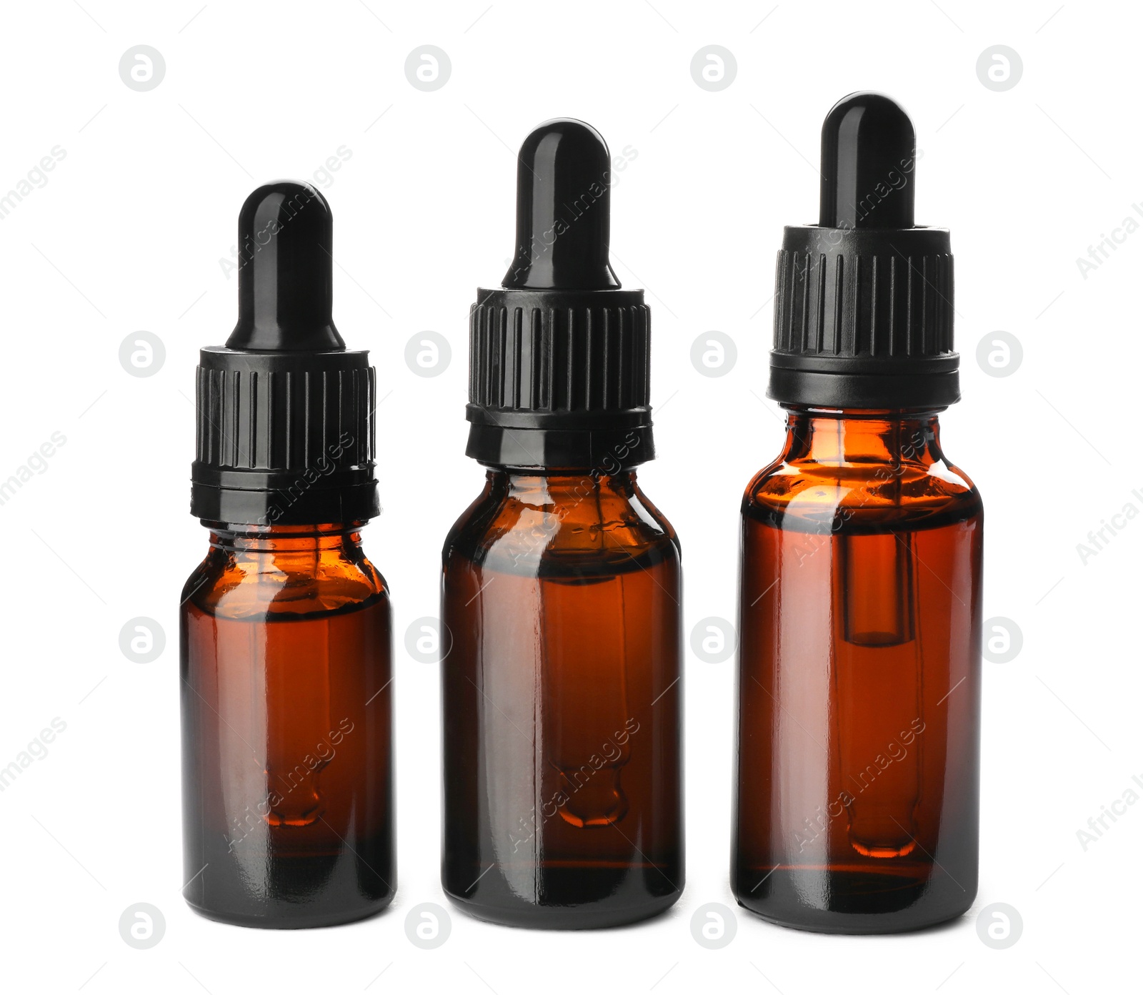 Photo of Bottles of essential oil isolated on white