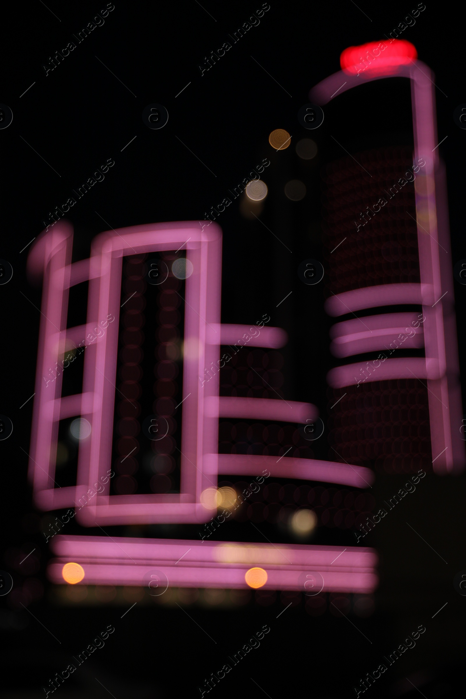 Photo of Blurred view of cityscape with bokeh effect. Night life