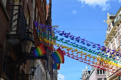 Bright rainbow LGBT pride flags on building facade