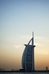 Photo of DUBAI, UNITED ARAB EMIRATES - NOVEMBER 03, 2018: Beautiful view of famous Burj Al Arab and amazing sunset sky