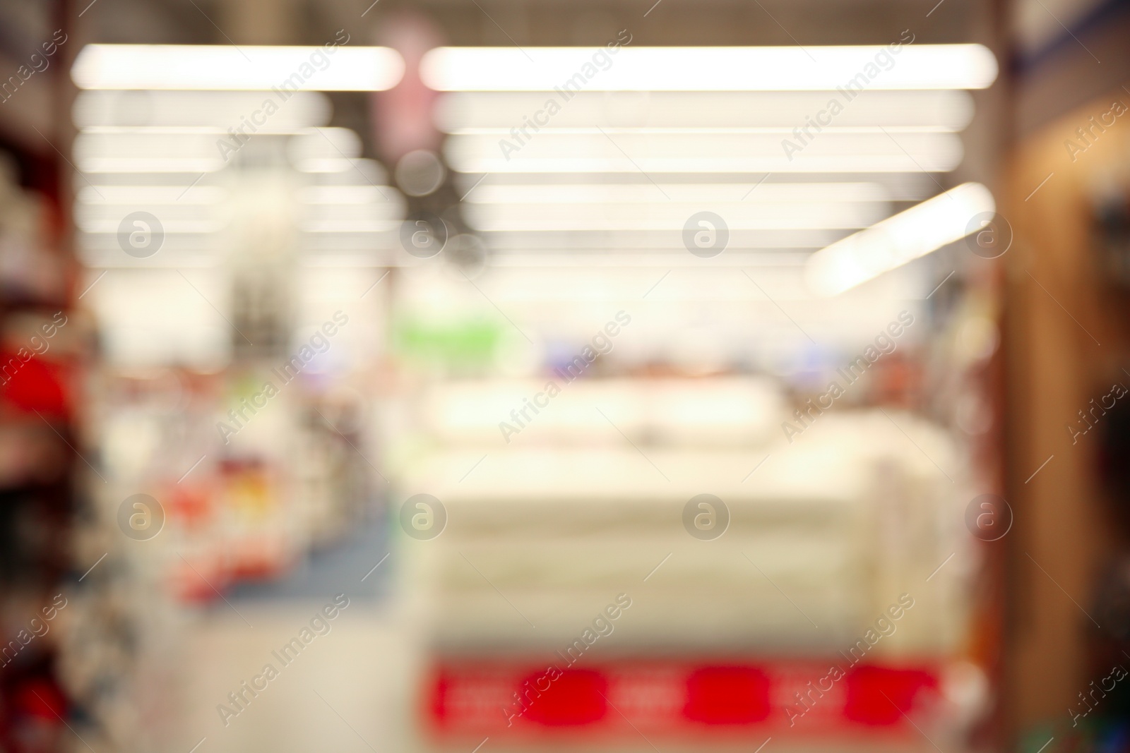 Photo of Blurred view of modern shopping mall interior