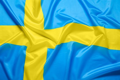 Photo of Flag of Sweden as background, top view. National symbol