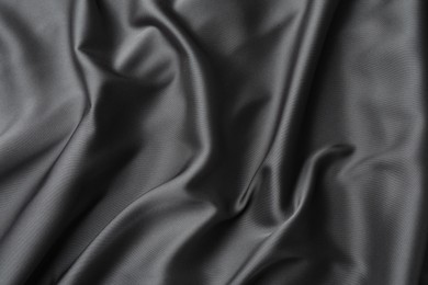 Texture of black crumpled silk fabric as background, top view