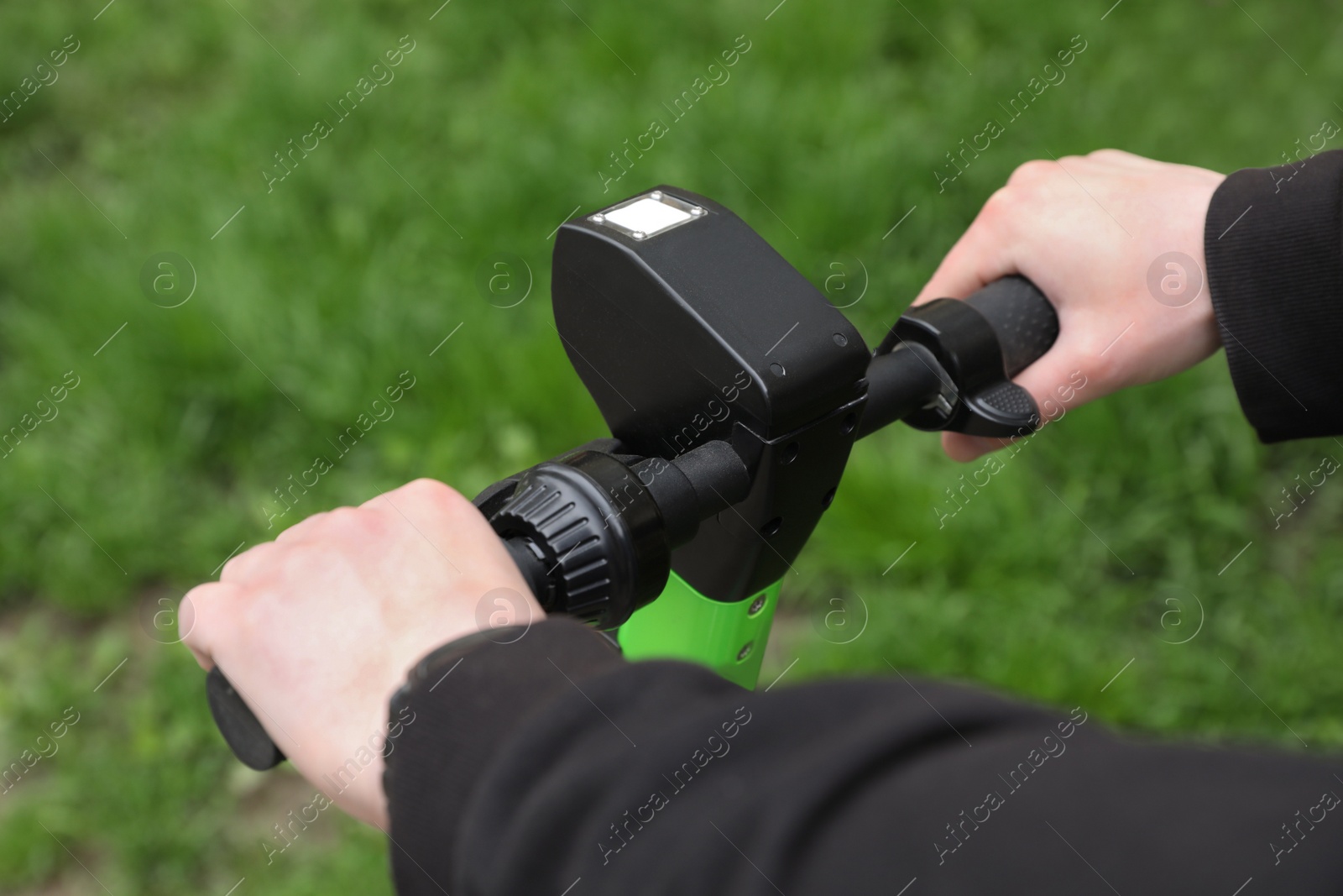 Photo of Man with electric kick scooter outdoors, closeup