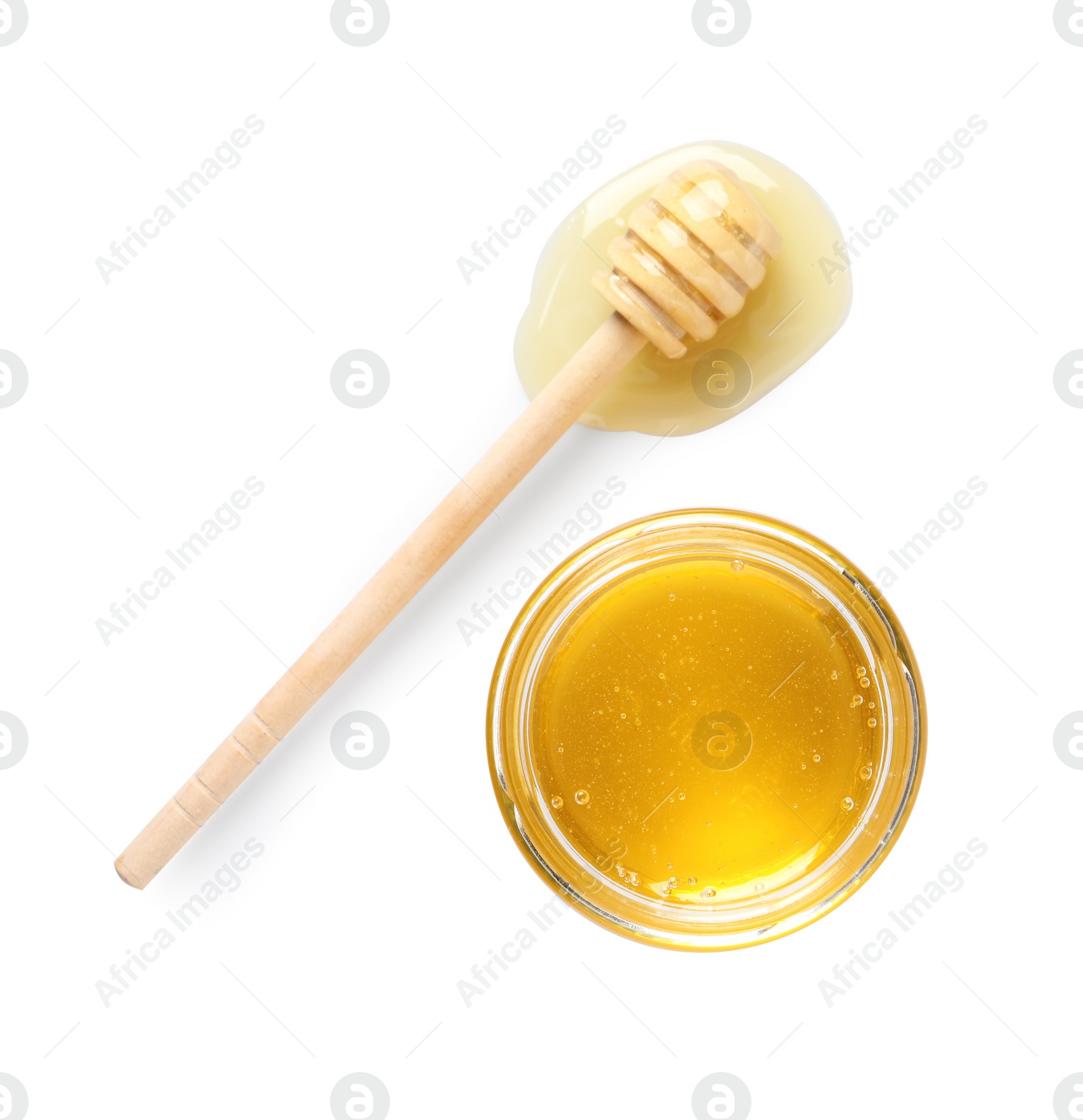 Photo of Tasty honey in glass jar and dipper isolated on white, top view