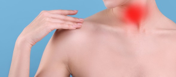 Image of Endocrine system. Woman suffering from pain in thyroid gland on light blue background, closeup. Banner design