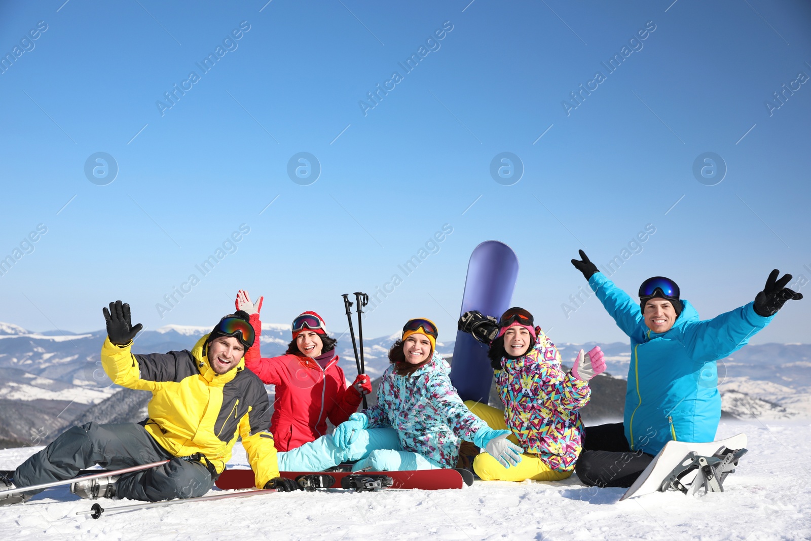 Photo of Group of friends with equipment at ski resort. Winter vacation