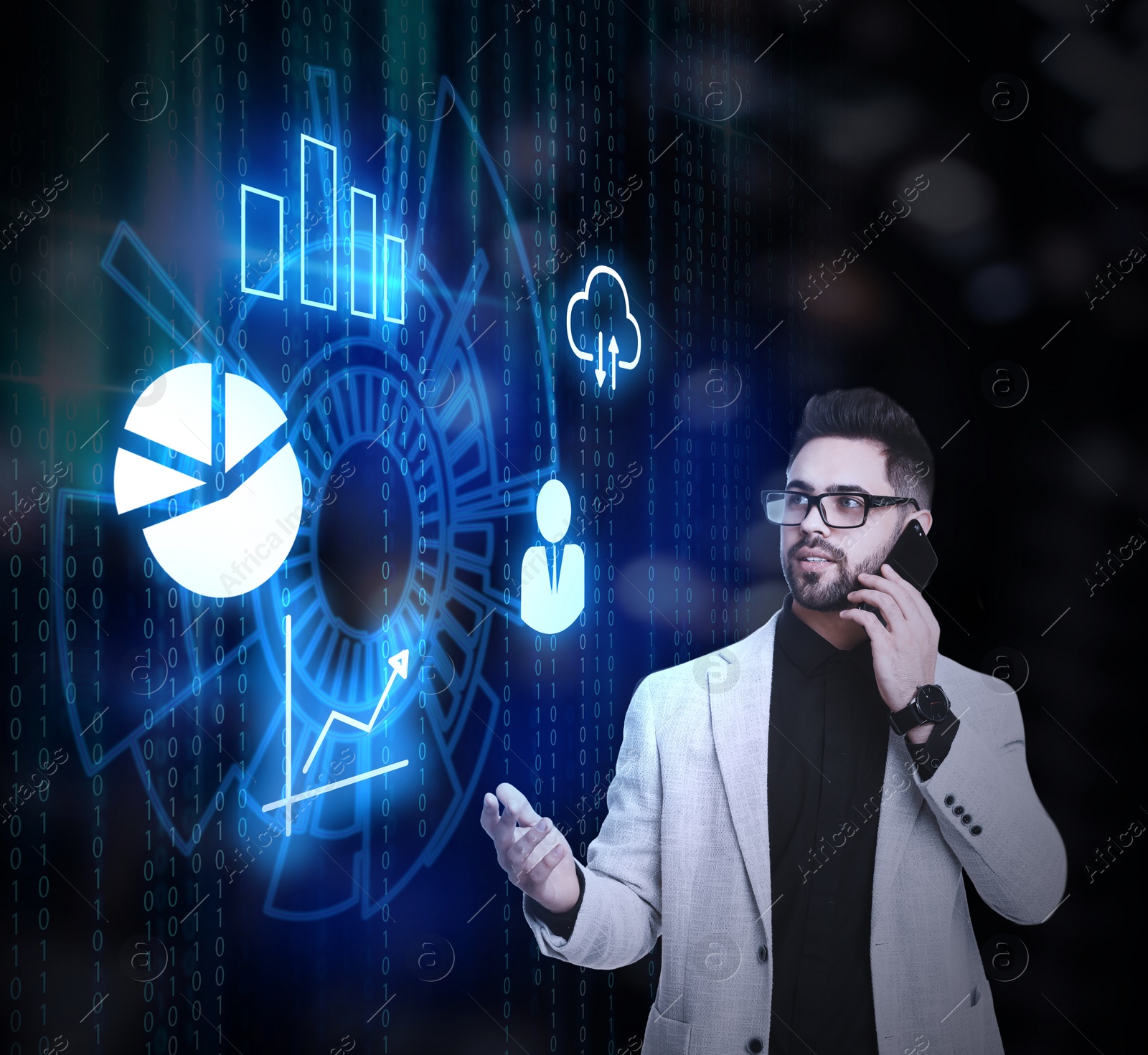 Image of Young businessman talking on smartphone near virtual screen with different icons and charts. Finance trading concept