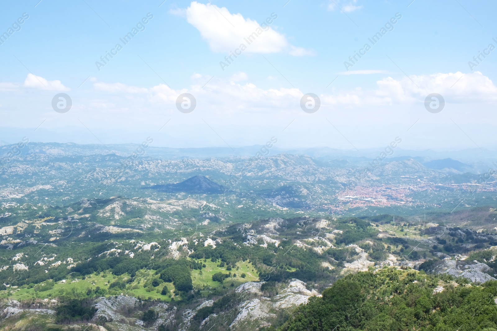 Image of Picturesque view of beautiful mountains under blue sky with clouds