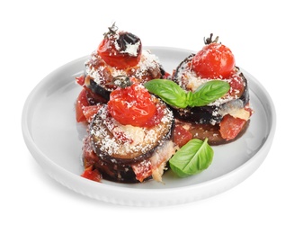 Photo of Baked eggplant with tomatoes, cheese and basil in plate isolated on white