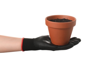 Woman holding terracotta flower pot filled with soil on white background, closeup