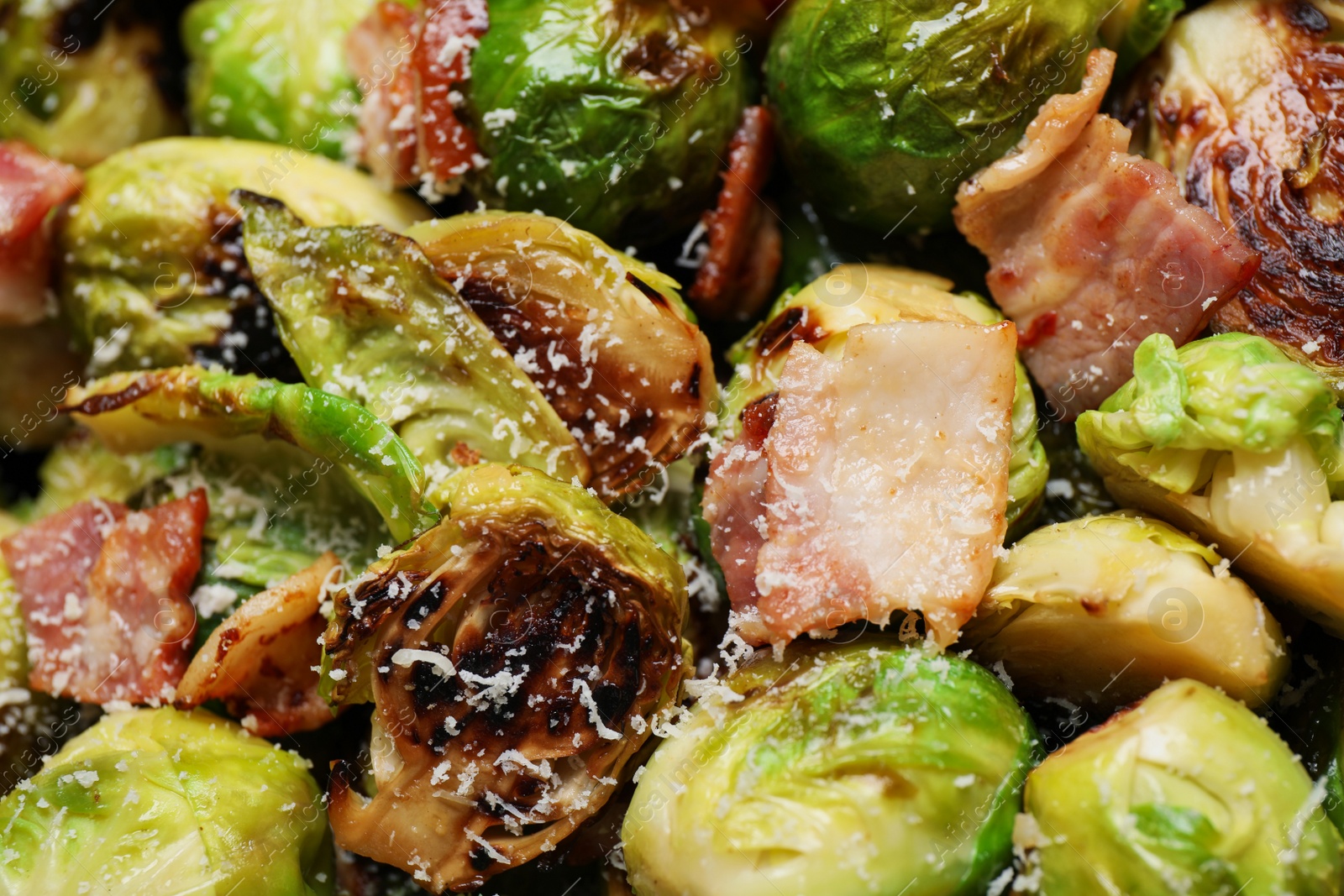 Photo of Closeup view of delicious Brussels sprouts with bacon