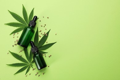 Photo of Flat lay composition with hemp leaves, CBD oil and THC tincture on green background, space for text