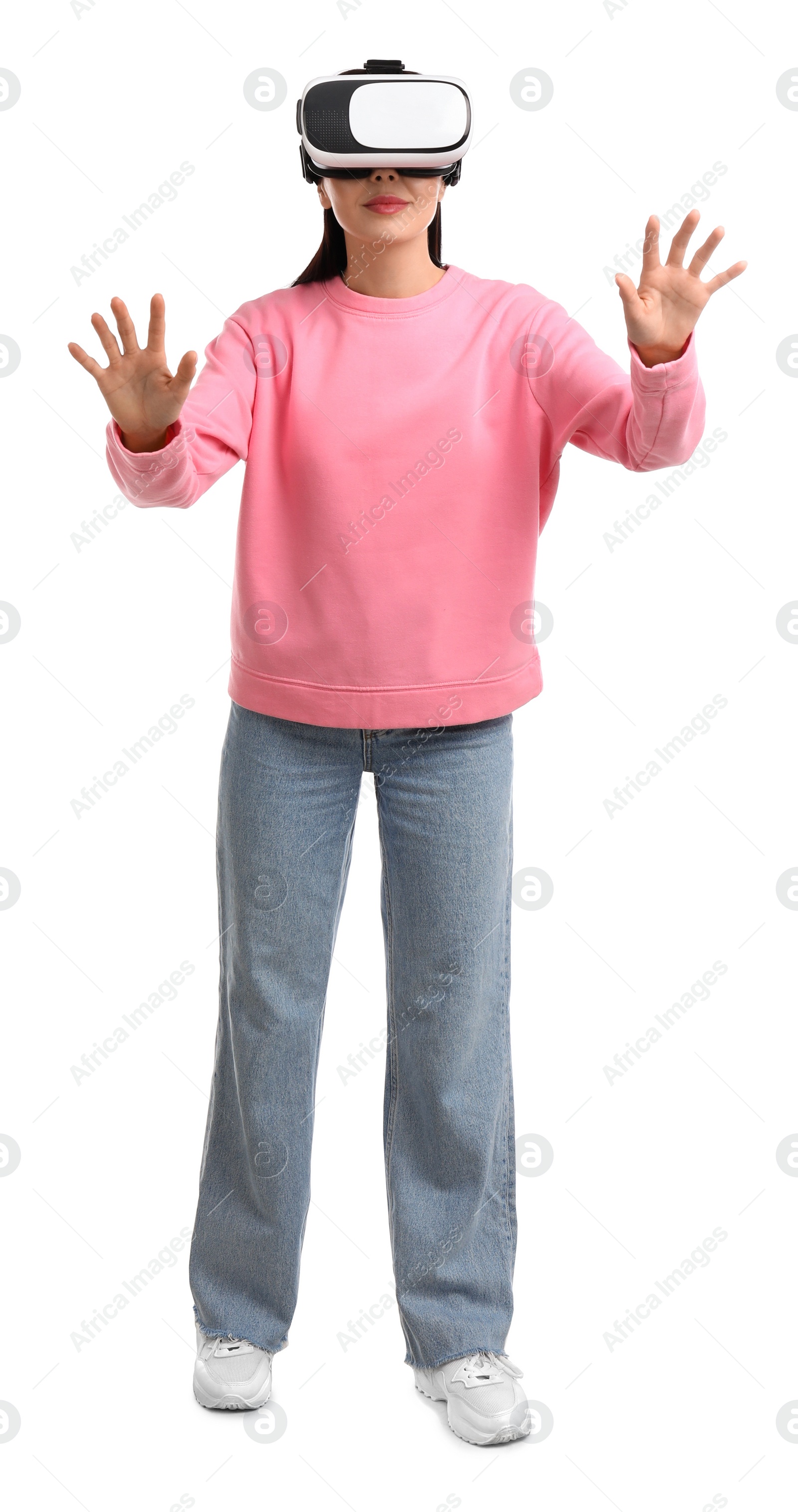 Photo of Woman using virtual reality headset on white background