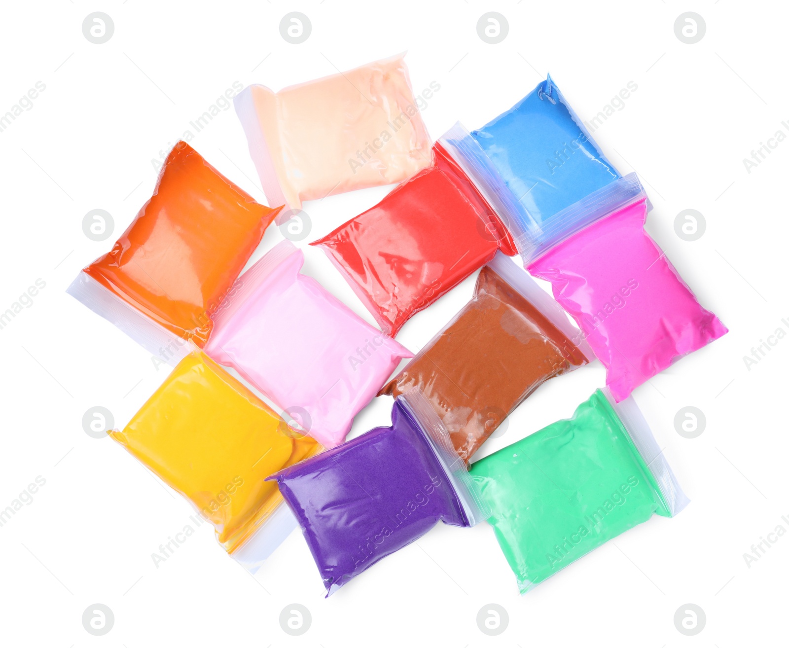 Photo of Many packages of different colorful plasticine on white background, top view