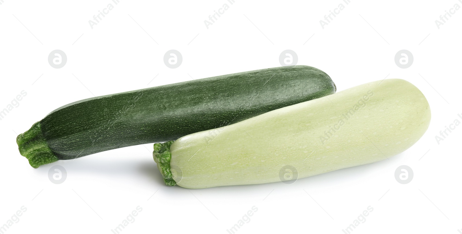 Photo of Fresh ripe green zucchinis isolated on white