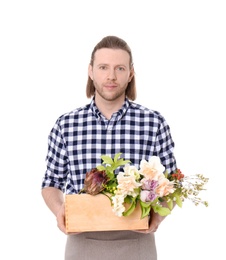 Male florist holding basket with flowers on white background
