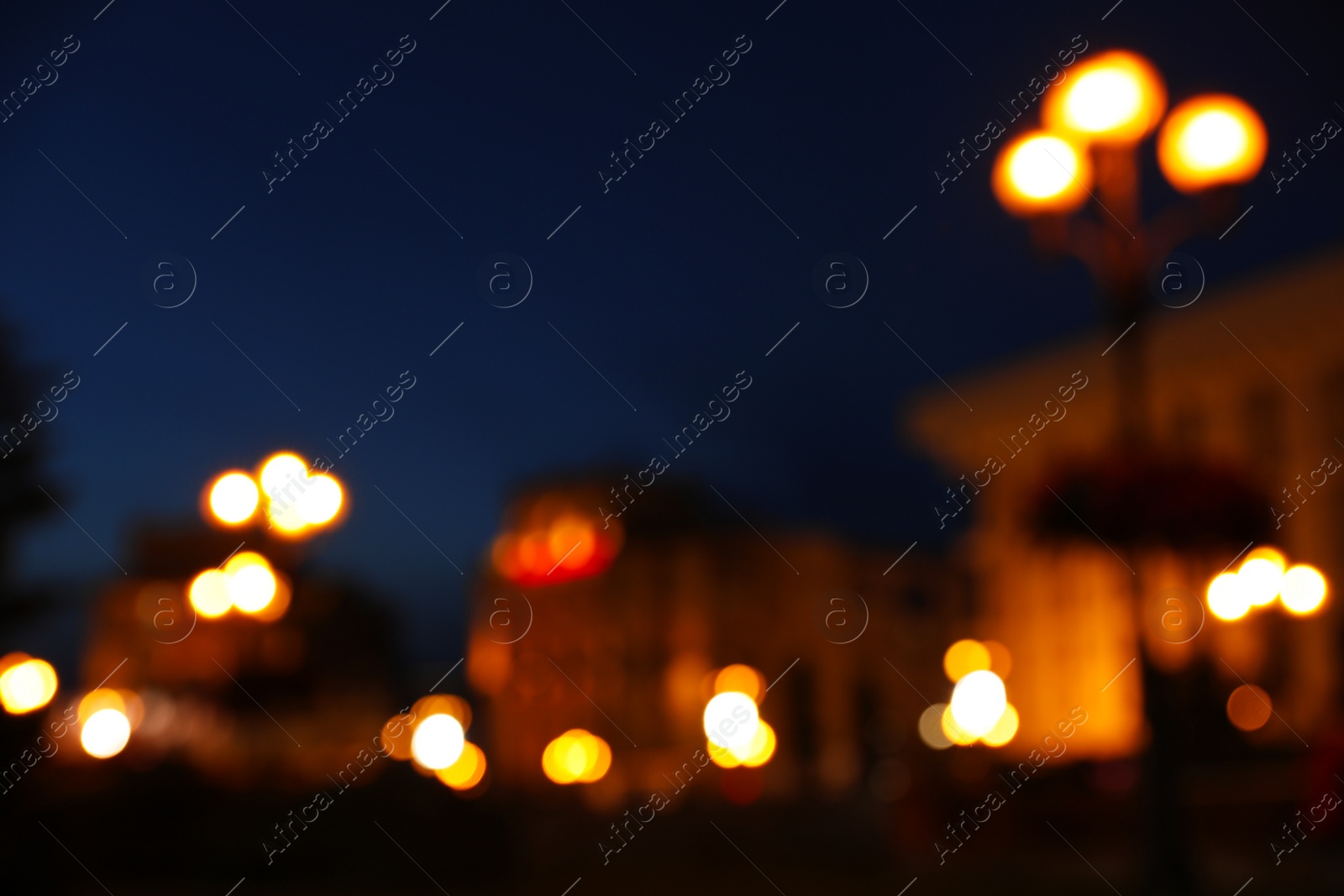 Photo of Blurred view of beautiful city at night. Bokeh effect