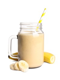 Photo of Mason jar of tasty banana smoothie and fresh fruit on white background