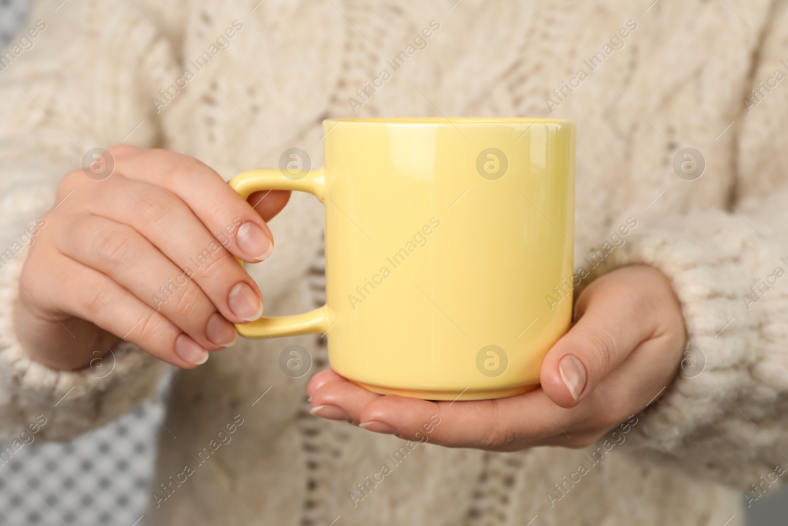 Photo of Woman holding mug of hot drink, closeup. Coffee Break