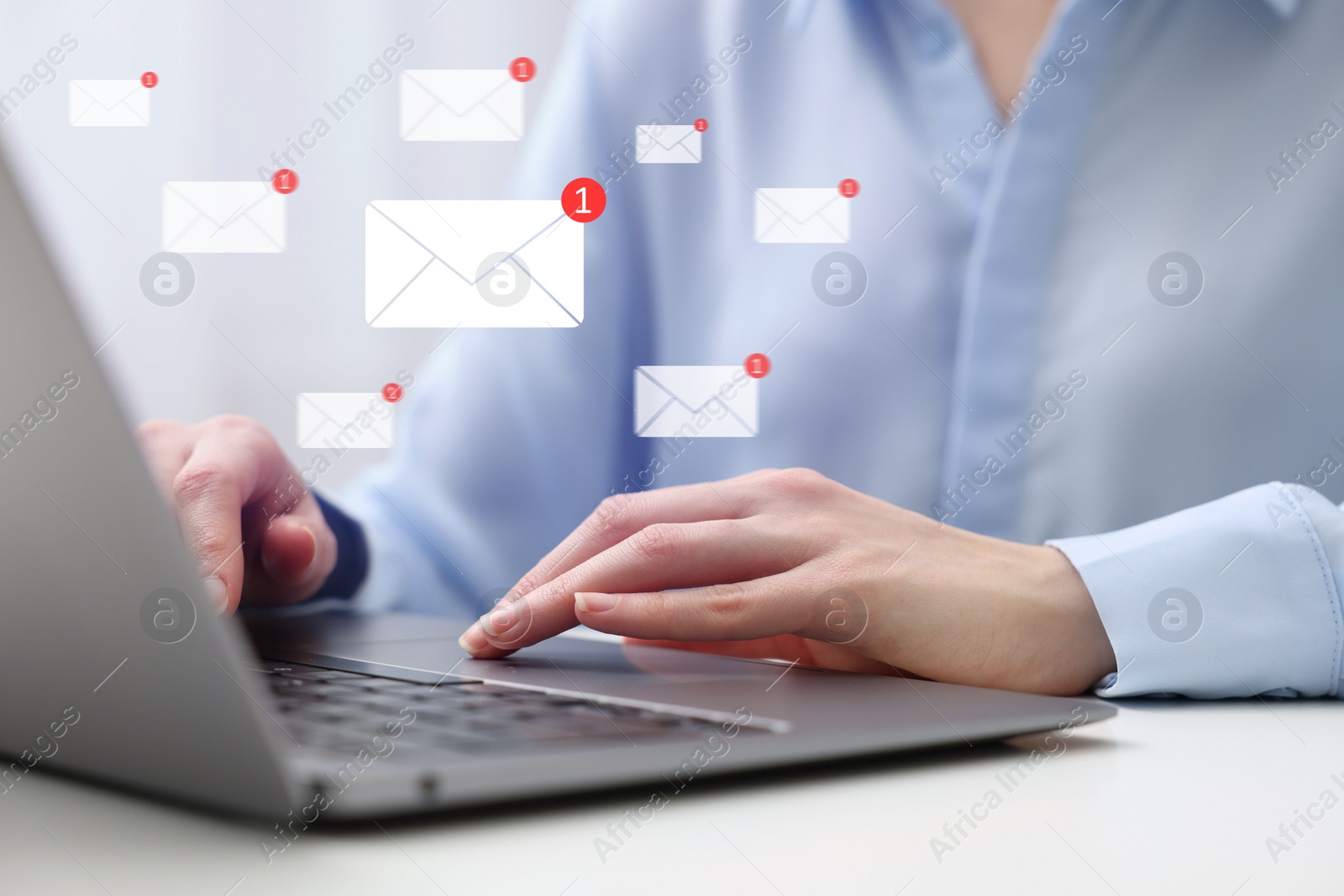 Image of Email. Woman using laptop at table, closeup. Incoming letter notifications over device