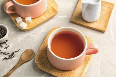 Photo of Cup of black tea on table