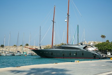 Photo of Beautiful view of sea port with different moored boats and yachts on sunny day