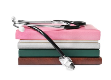 Stethoscope and notebooks on white background. Medical students stuff