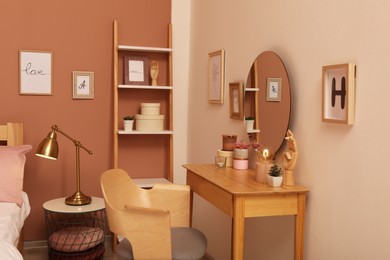 Teenage girl's bedroom interior with dressing table and mirror