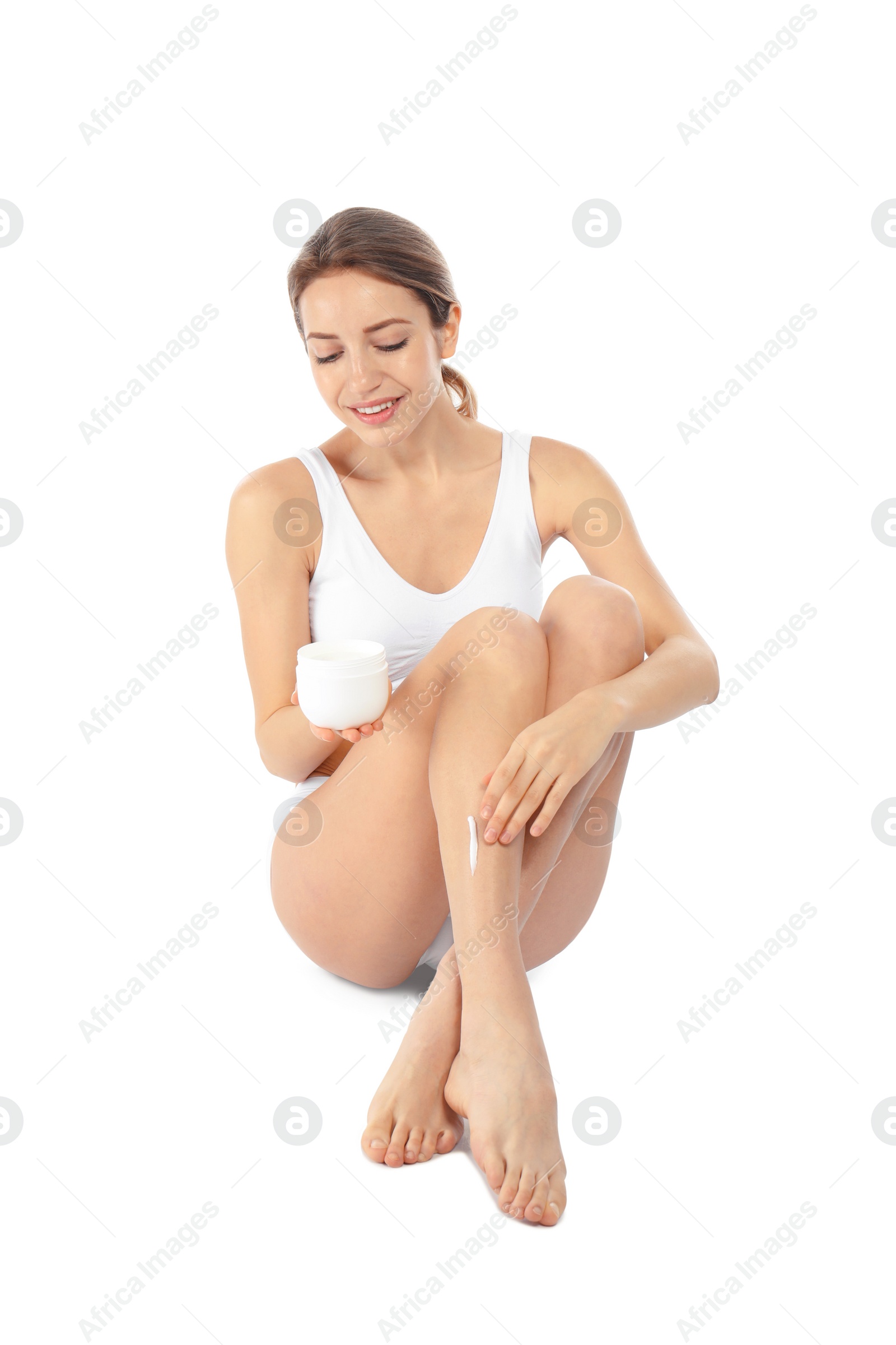 Photo of Young woman with jar of cream on white background. Beauty and body care