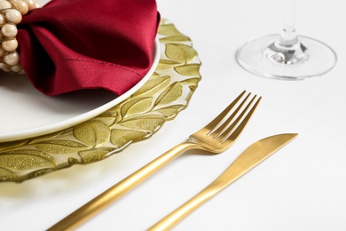 Elegant table setting on white background, closeup