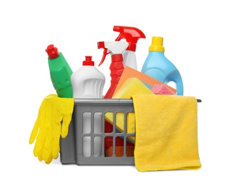 Photo of Basket with different cleaning products and tools on white background