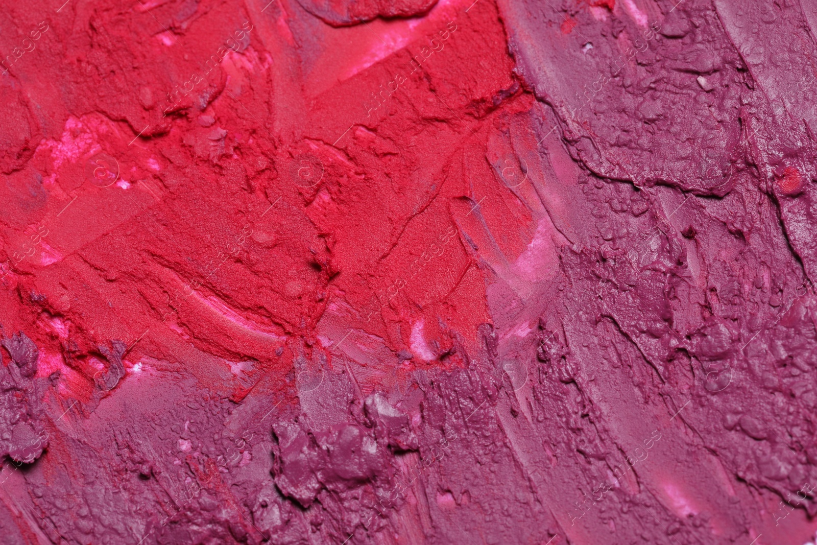 Photo of Texture of beautiful lipsticks as background, closeup