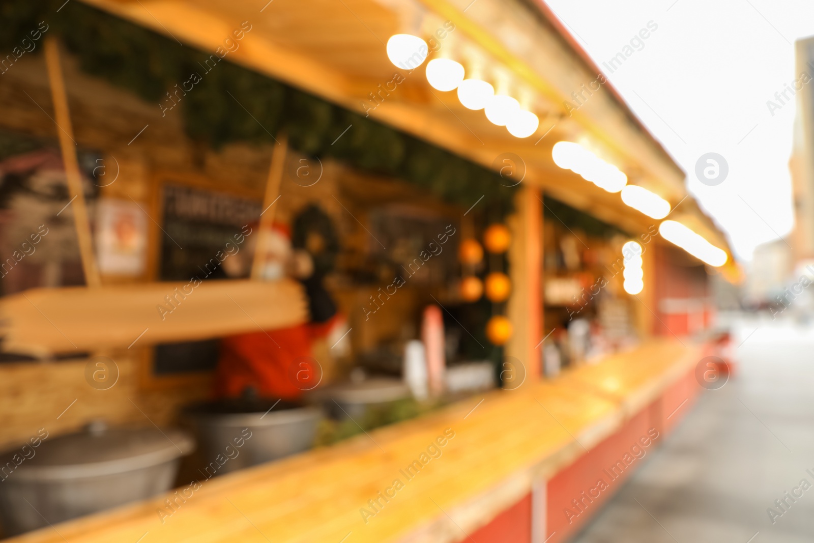 Photo of Blurred view of Christmas fair stall outdoors