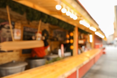 Photo of Blurred view of Christmas fair stall outdoors