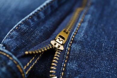 Photo of Blue jeans with zipper as background, closeup view