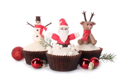 Photo of Tasty Christmas cupcakes and festive decor on white background