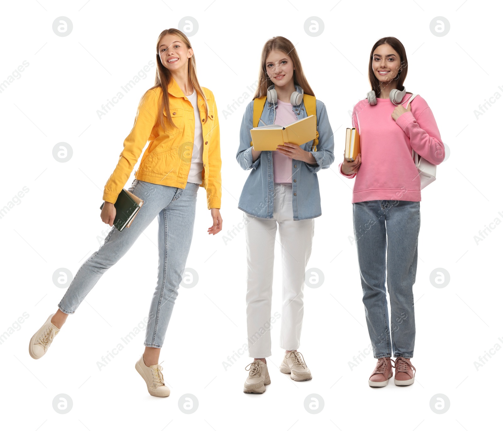 Image of Group of happy students with books on white background