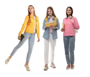 Group of happy students with books on white background