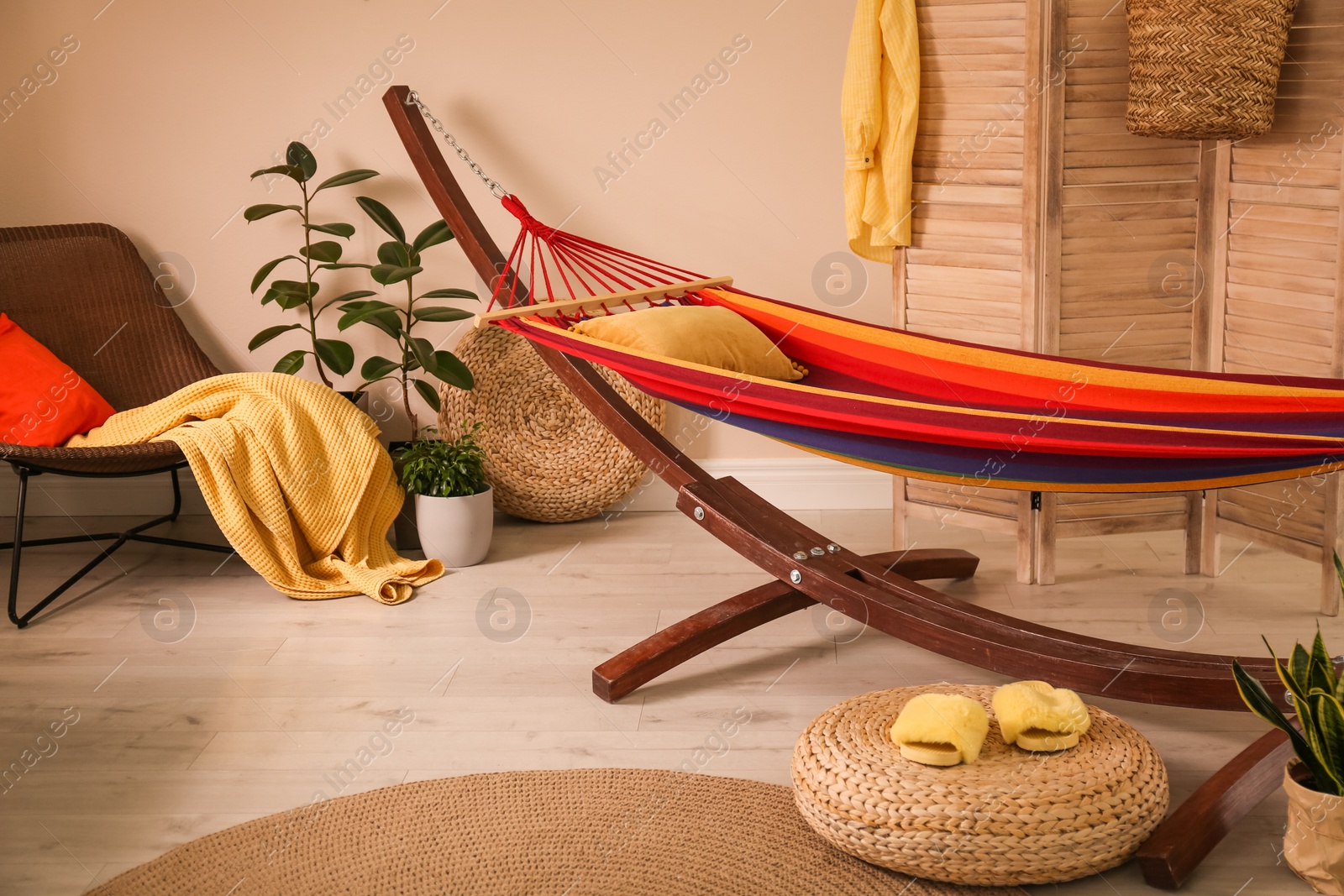 Photo of Colorful hammock with pillow in modern room interior