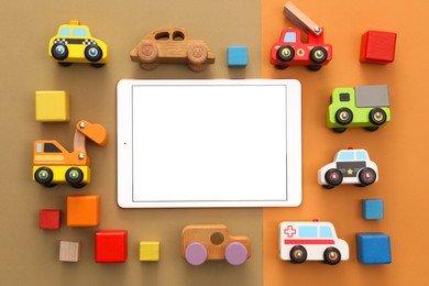 Modern tablet and toys on color background, flat lay. Space for text