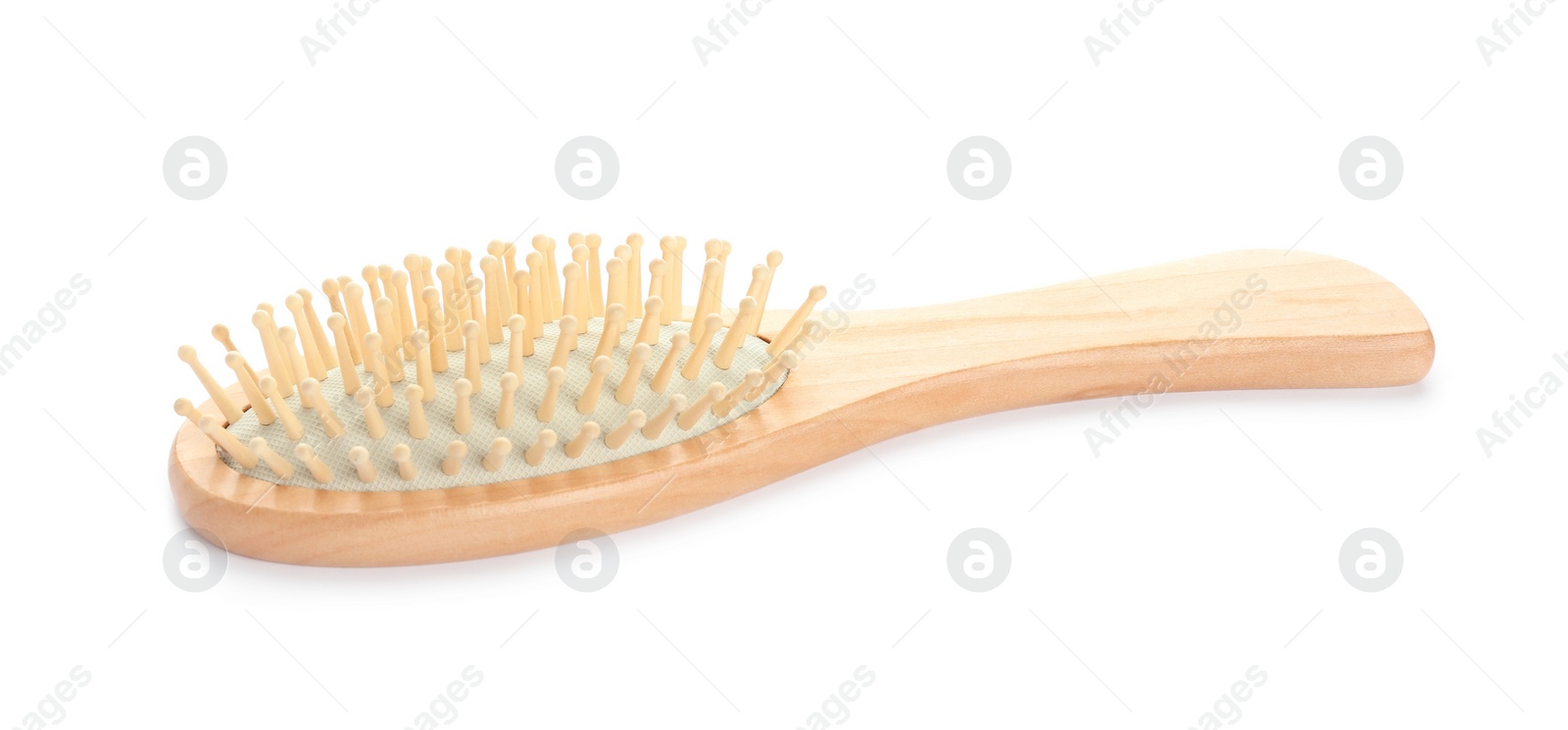 Photo of New wooden hair brush isolated on white