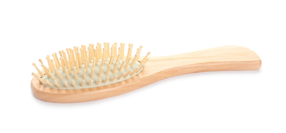 Photo of New wooden hair brush isolated on white