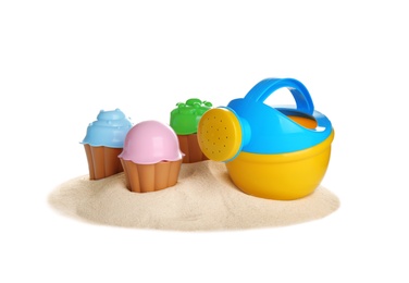 Photo of Set of plastic beach toys and pile of sand on white background