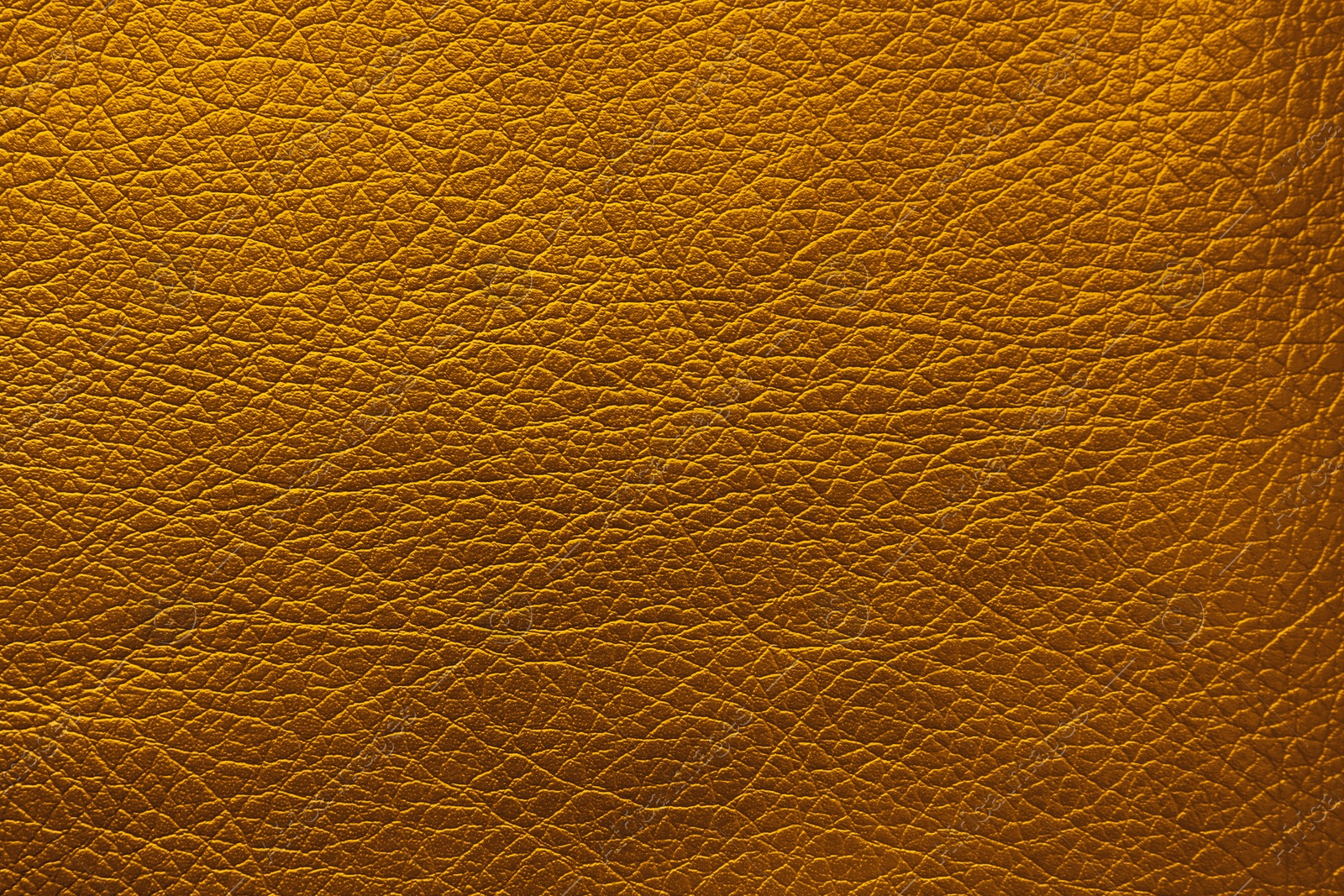 Image of Golden textured surface as background, closeup view