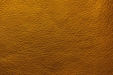 Image of Golden textured surface as background, closeup view