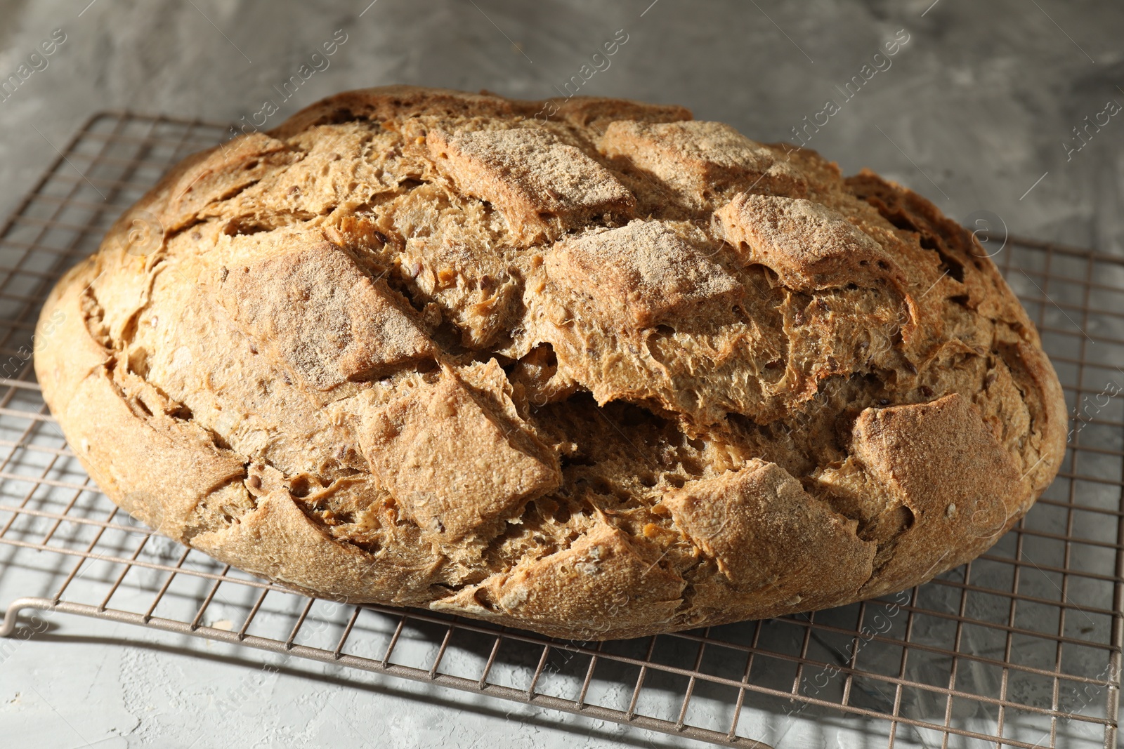 Photo of Freshly baked sourdough bread on grey table