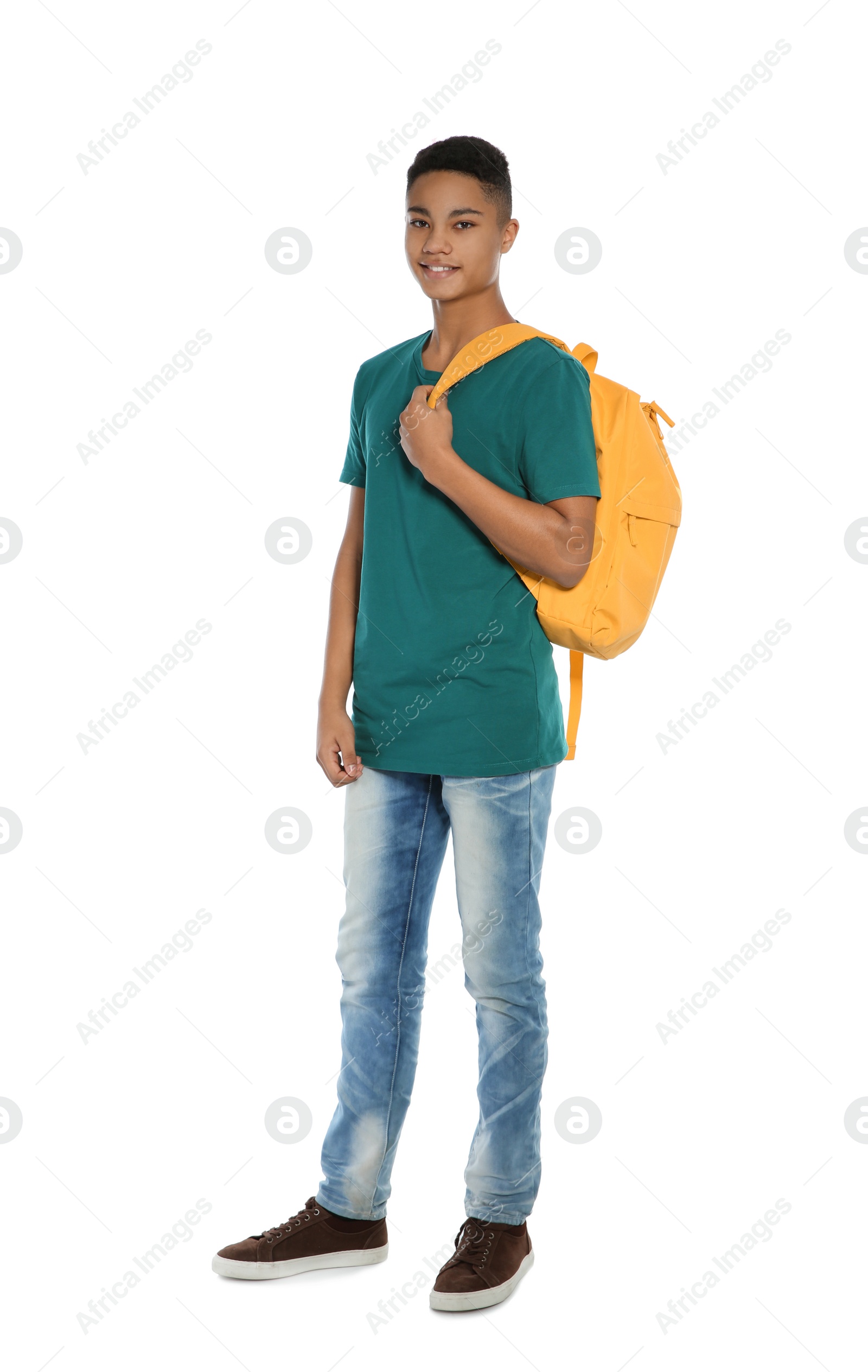 Photo of African-American teenager boy in casual clothes on white background